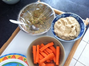 Healthy snacks... homemade guacamole, homemade tahini dip and carrot sticks.